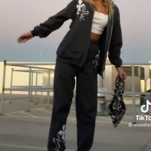 SOLD y2k black zip up hoodie w/cross zebra patches